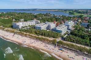 Guests can enjoy access to the beach from this coastal hotel, surrounded by lush greenery and scenic views.