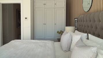 Una camera da letto con un letto, un armadio, uno specchio e un comodino.
