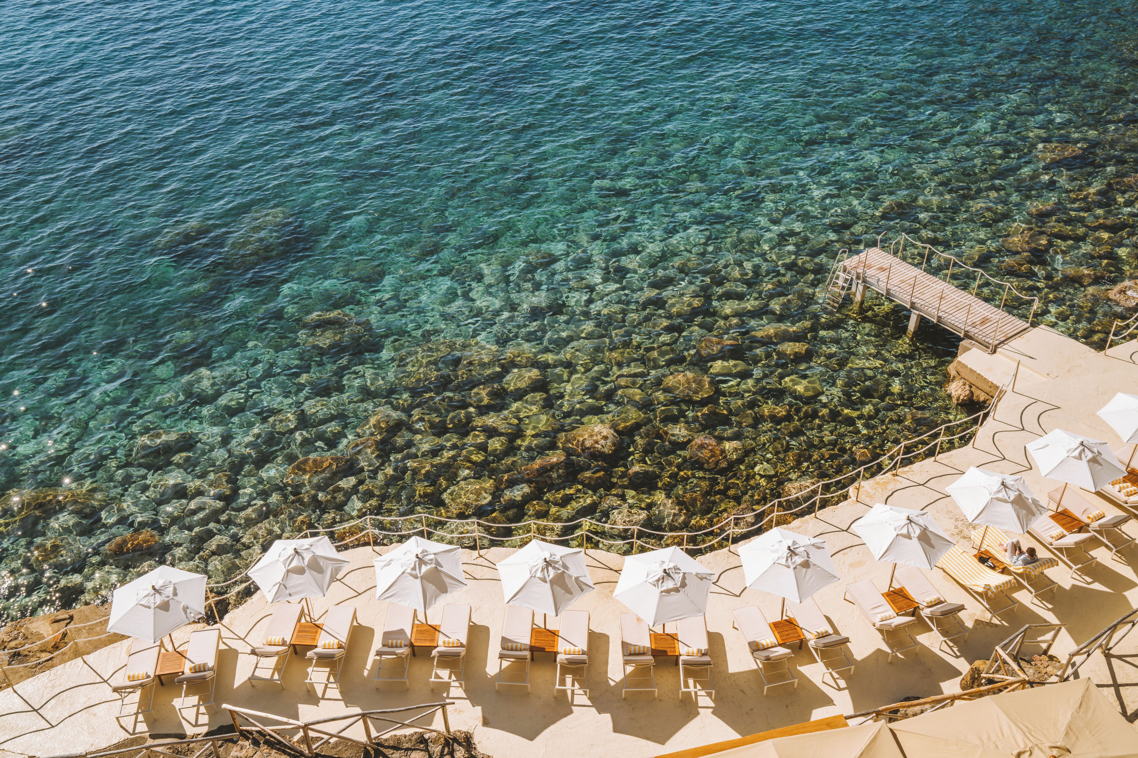 Private beach, white sand, sun-loungers, beach umbrellas
