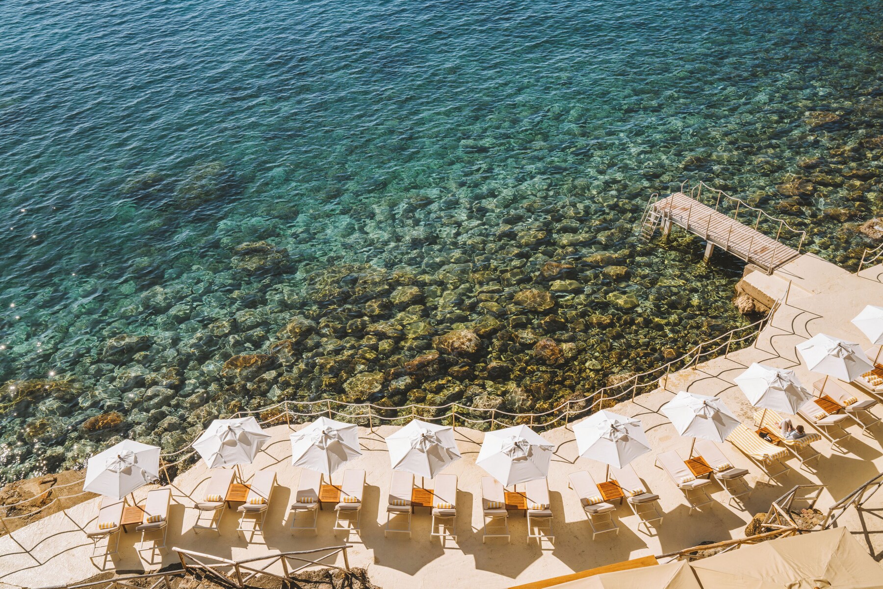Private beach, white sand, sun loungers, beach umbrellas