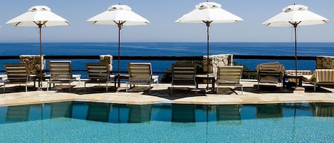 Seasonal outdoor pool, pool umbrellas, pool loungers