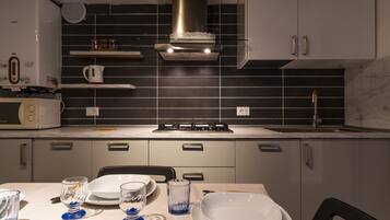 Apartment, 2 Bedrooms | Private kitchenette | Full-sized fridge, microwave, stovetop, dishwasher