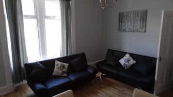 Apartment, 2 Bedrooms | Living area | Flat-screen TV