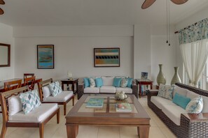 Luxury Apartment, Beach View, Beachfront | Living area | Flat-screen TV - Costa del Sol 2 - 101 (Guayacanes)