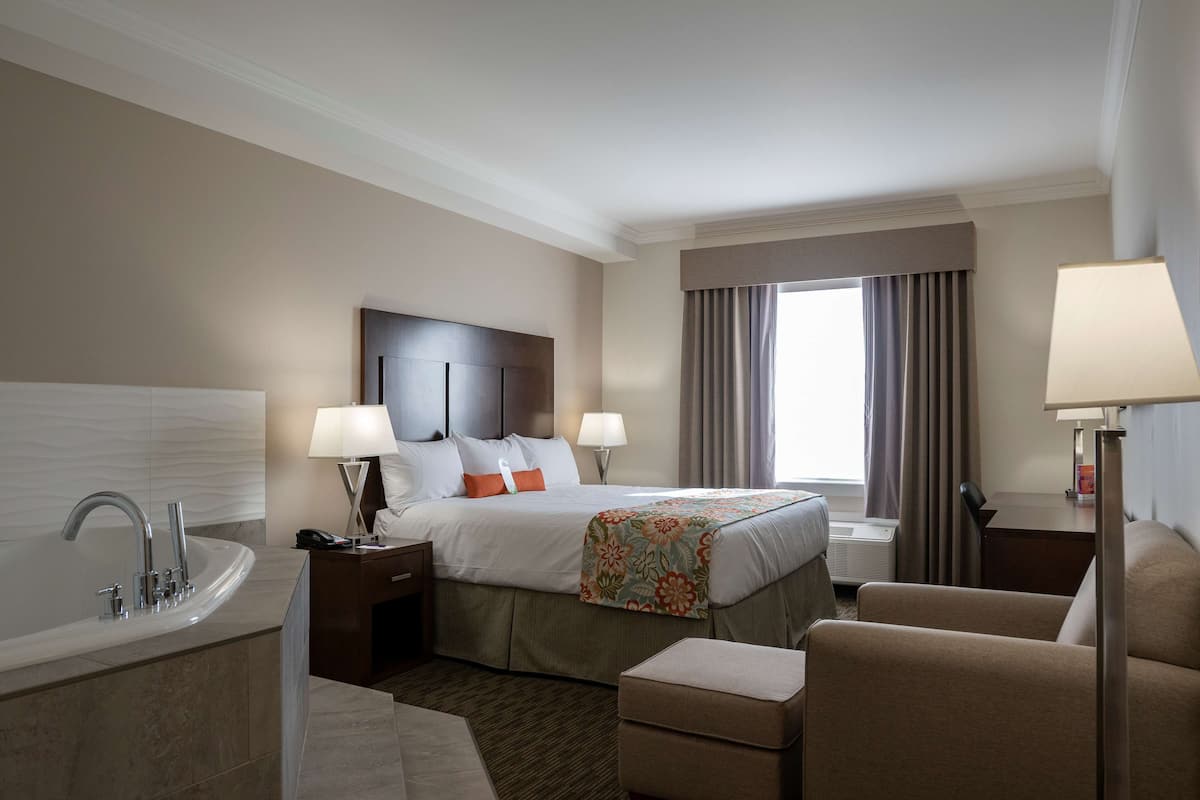 premium suite, 1 king bed, jetted tub (coast premium king suite with jet tub) | in-room safe, desk, blackout curtains, iron/ironing board