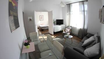 Family Apartment, 1 Bedroom, Garden View | Living area | Flat-screen TV