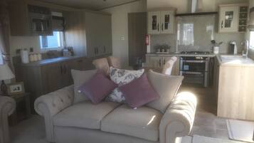 Superior Mobile Home, 2 Bedrooms | Living room | Flat-screen TV, fireplace