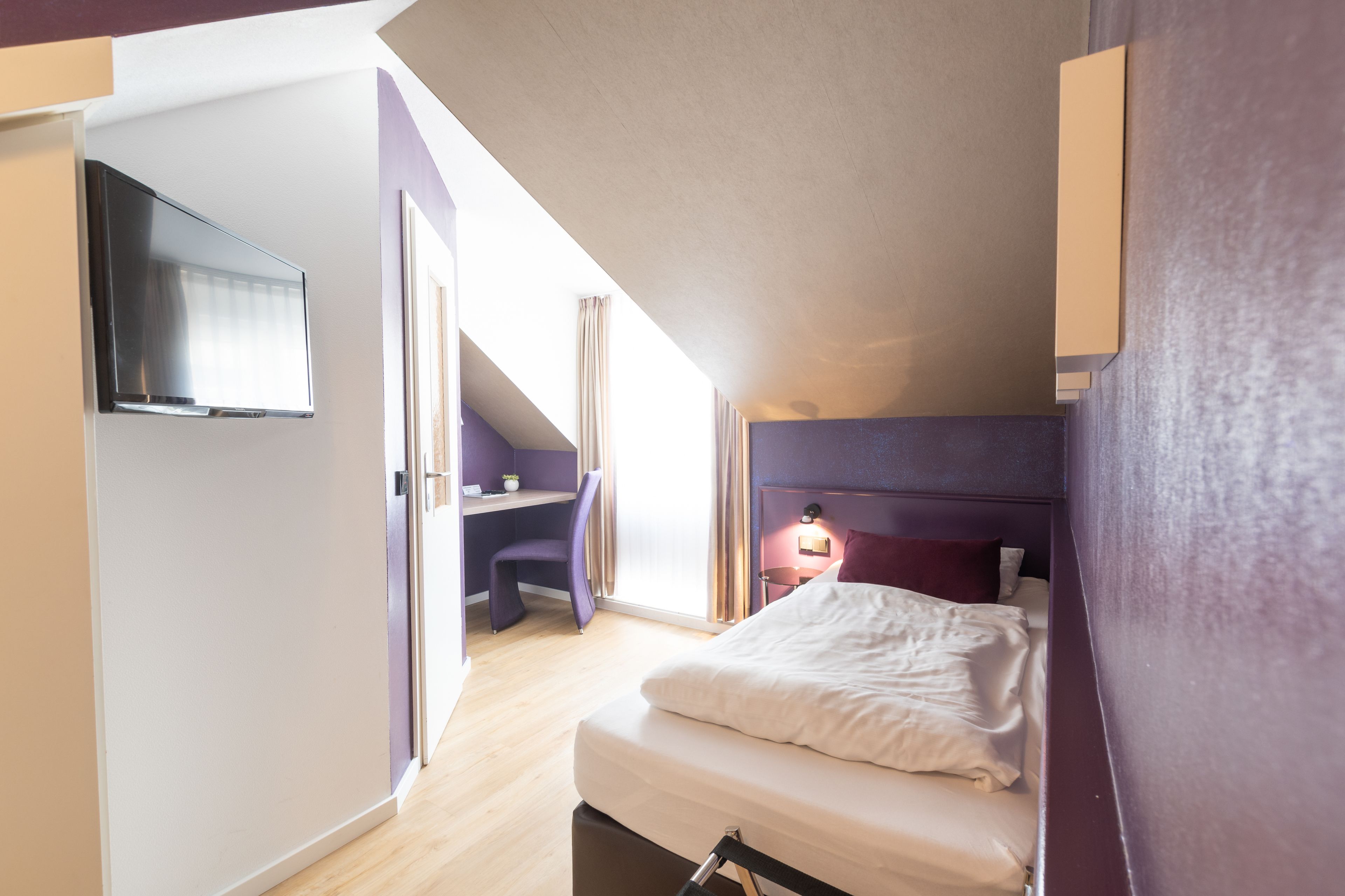 single room | premium bedding, desk, blackout curtains, soundproofing