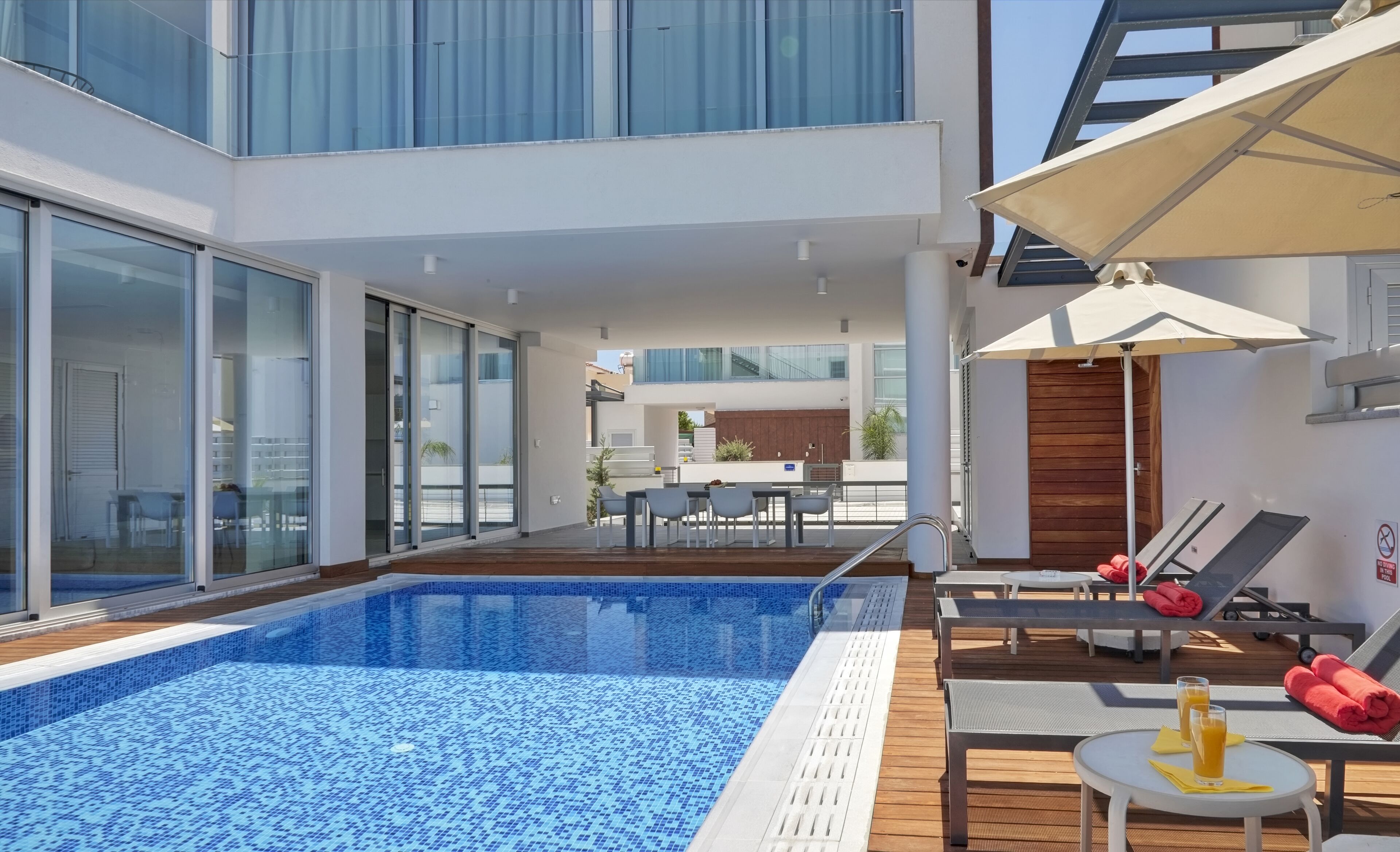 Outdoor pool, pool umbrellas, pool loungers