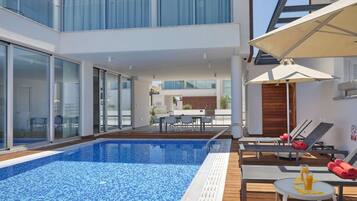 Outdoor pool, pool umbrellas, pool loungers