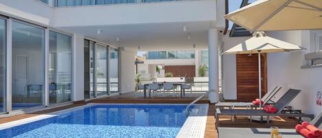 Outdoor pool, pool umbrellas, pool loungers