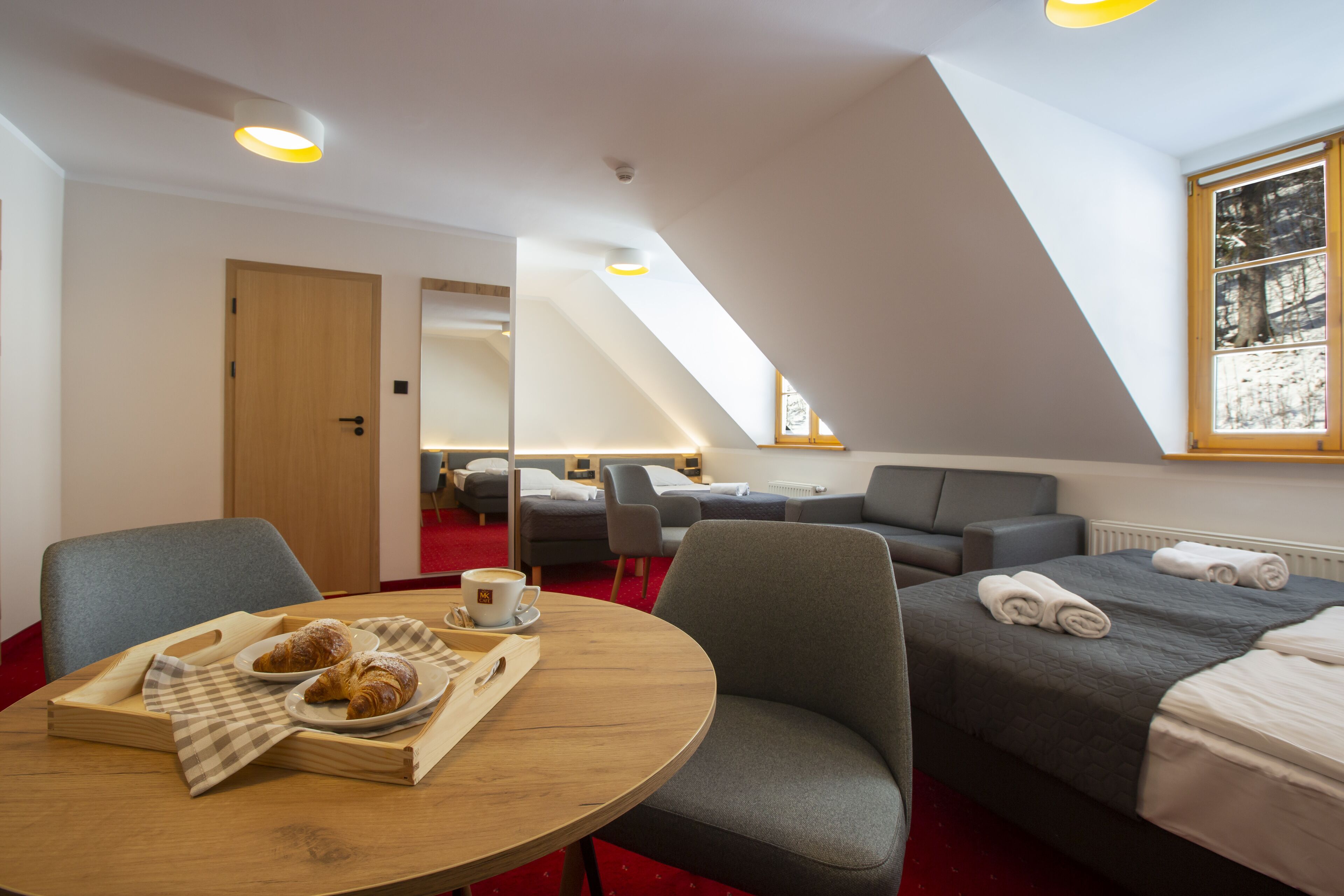 Family Quadruple Room, Non Smoking | Living area | Flat-screen TV