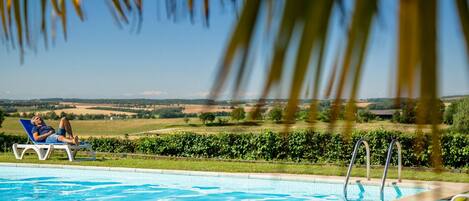 Outdoor pool, pool umbrellas, sun loungers