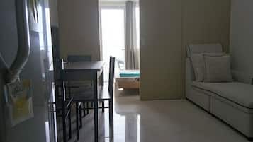 Condo, 1 Bedroom, Balcony, City View | Living area | Flat-screen TV
