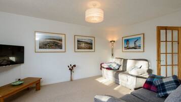 Apartment, Multiple Beds | Living area | TV