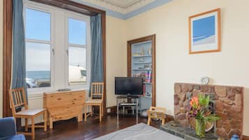 Apartment, Multiple Beds | Living area | TV