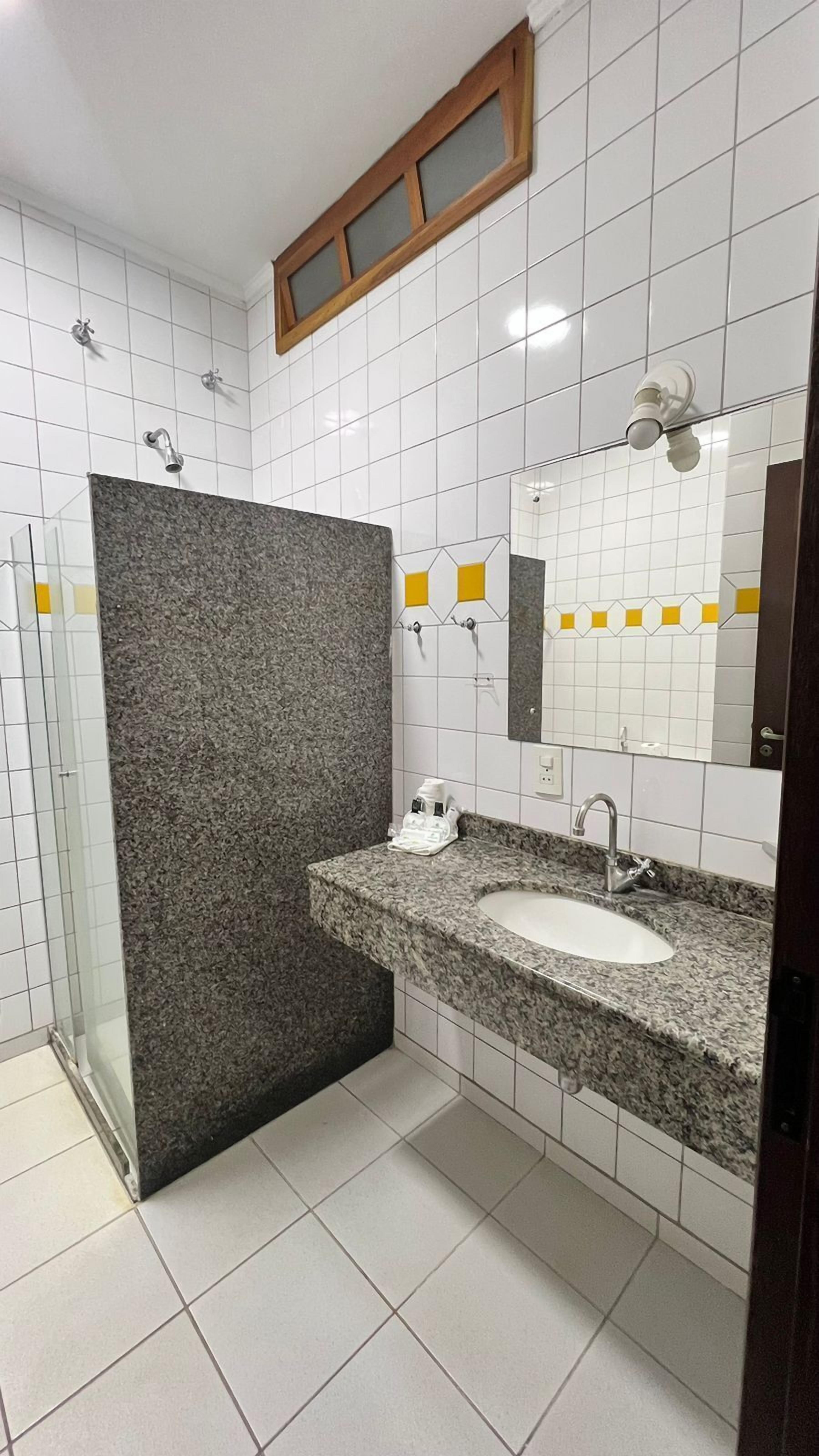 designer toiletries, hair dryer, towels, soap