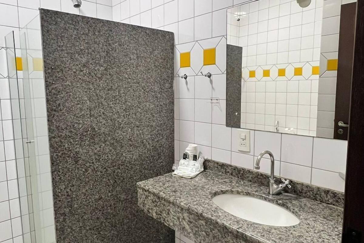 designer toiletries, hair dryer, towels, soap