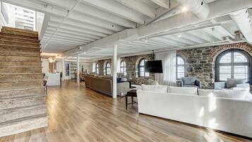 Elite Penthouse, 4 Bedrooms (Unit 3) | Living area | 65-inch flat-screen TV with cable channels, TV, Netflix