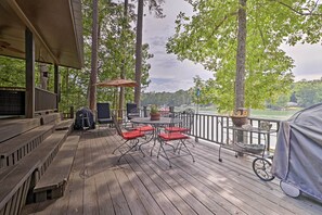 Enjoy al fresco dining on the deck overlooking the water, with a barbecue grill and comfortable seating for four.