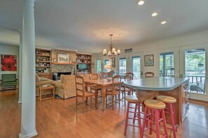 Enjoy a communal dining experience in this well-appointed space with a large dining area and modern kitchen.