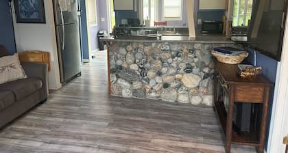 Waterfront cottage in Elk Rapids on Bass Lake. Firepit, dog ok