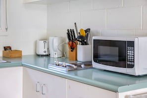 Fridge, microwave, stovetop, cookware/dishes/utensils