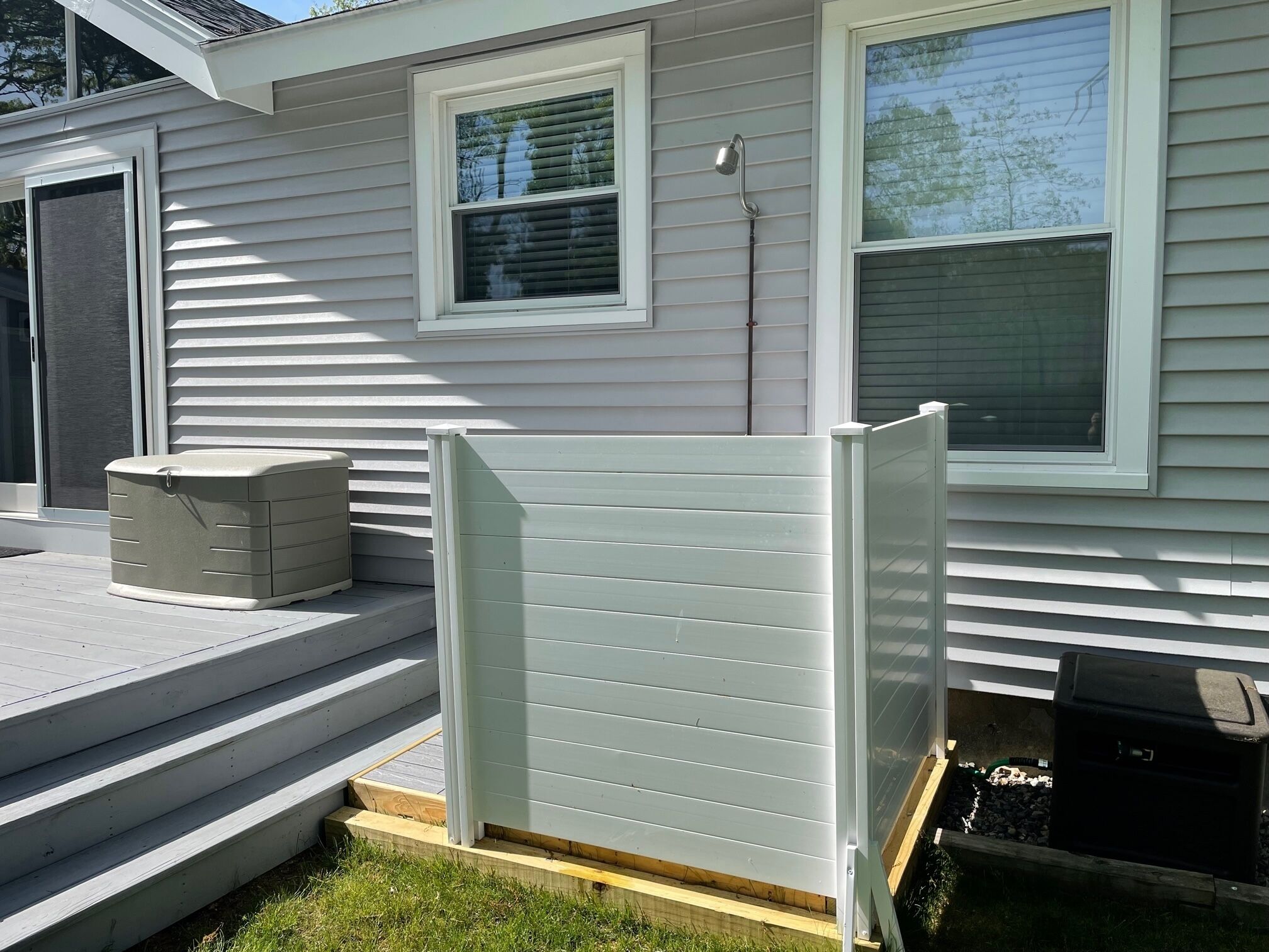 A house with a front porch, a small window, and a door.