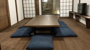 A traditional Japanese room with tatami flooring, a low table, and shoji screens. - Komatsucho 11-41 (Kyoto)