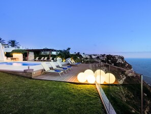 Outdoor pool, a heated pool, pool loungers