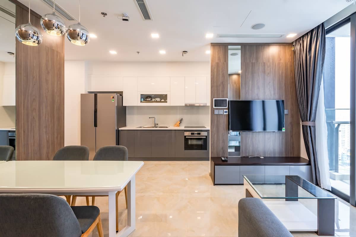 Standard Apartment, 2 Bedrooms | Living room | 50-inch flat-screen TV with cable channels, TV