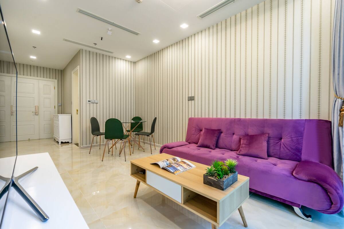 Deluxe Apartment, 1 Bedroom | Living room | 50-inch flat-screen TV with cable channels, TV