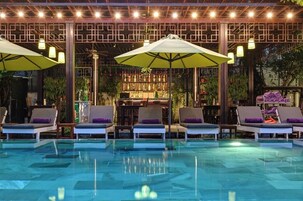 Outdoor pool, open 6 AM to 7:00 PM, pool umbrellas, pool loungers