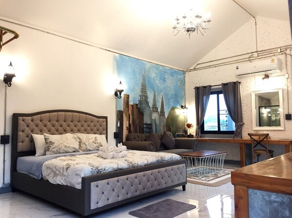 A bedroom with a large bed, a cityscape mural, a chandelier, and an air conditioning unit. - Home Ayutthaya (Ayutthaya)