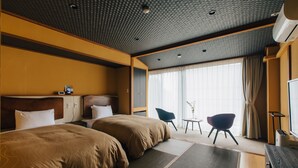 A hotel room with two beds, a desk, a chair, and a large window with curtains. - Atami Fuga (Atami)