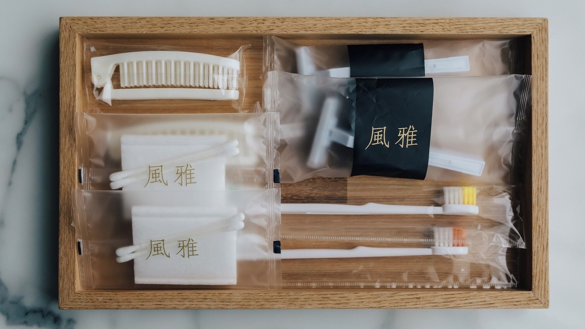 A wooden box containing various toiletries and personal care items.