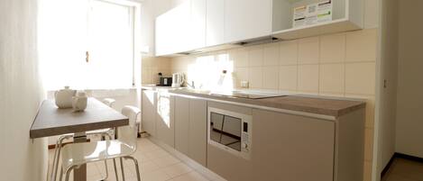 Apartment (1 Bedroom) | Private kitchen | Fridge, microwave, stovetop, dishwasher