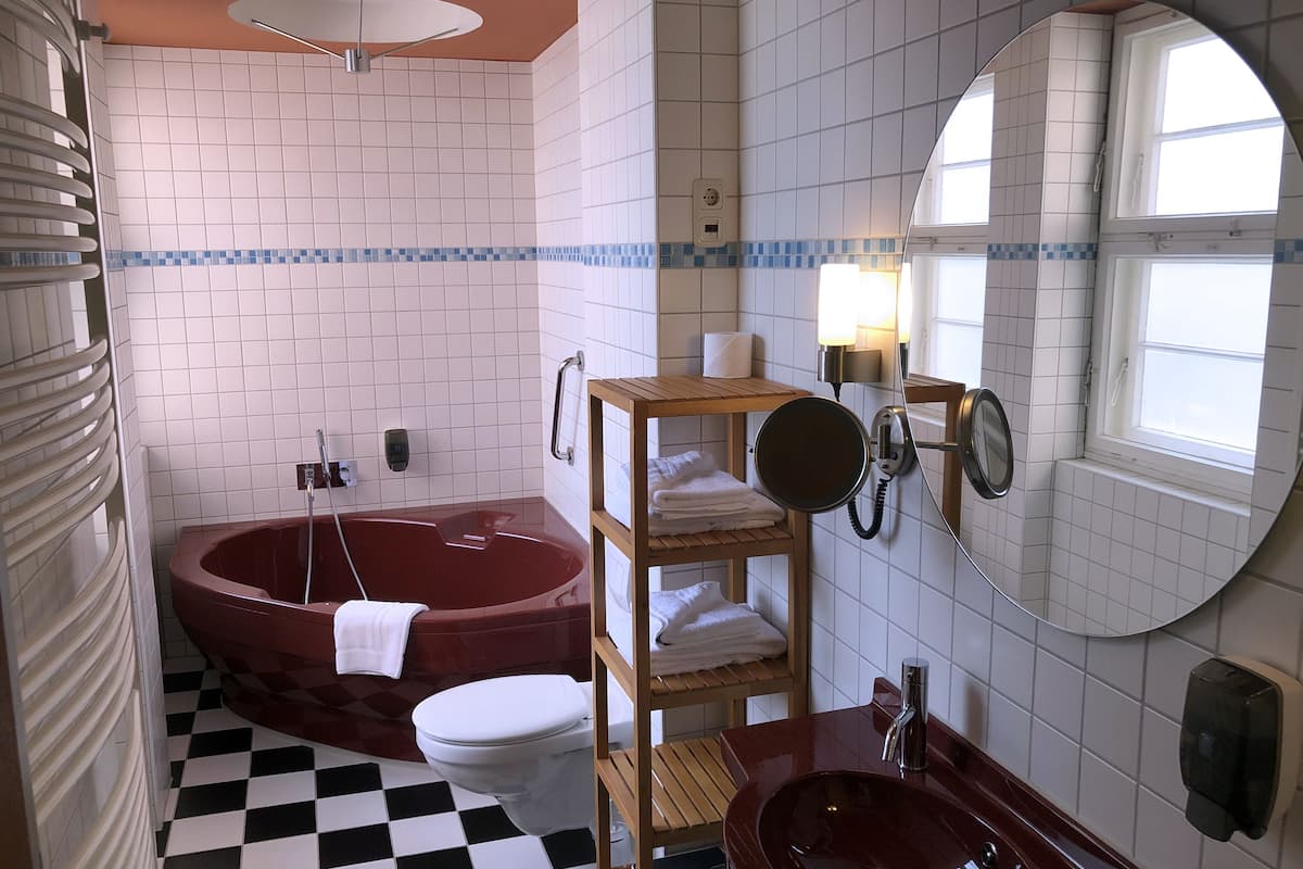 premium double room | bathroom | hair dryer, toilet paper