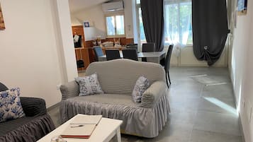 Apartment, 3 Bedrooms | Living area | Flat-screen TV