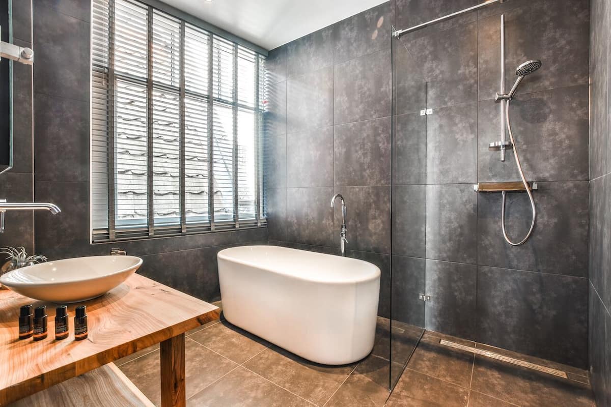 deluxe suite, bathtub | bathroom | separate bathtub and shower, deep-soaking bathtub, designer toiletries