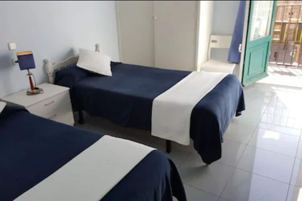 Twin Room, 2 Twin Beds, Shared Bathroom (Private Shower) | In-room safe, WiFi (free), bed sheets