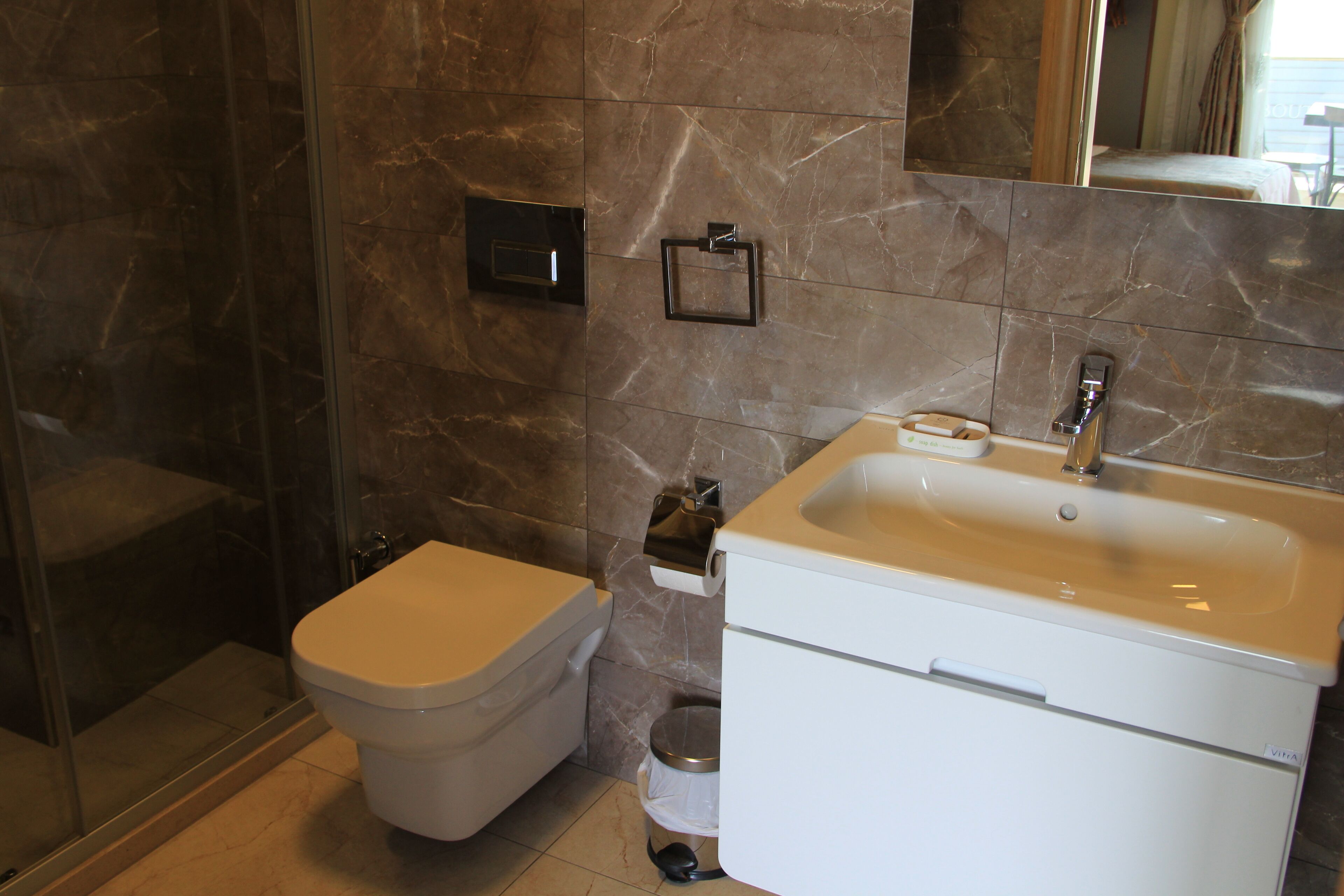 deluxe triple room, partial sea view | bathroom | shower, free toiletries, hair dryer, slippers