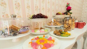 A buffet table with various food items, including pastries, cookies, and fruit. - De Sky Sukhumvit Ekkamai (Bangkok)
