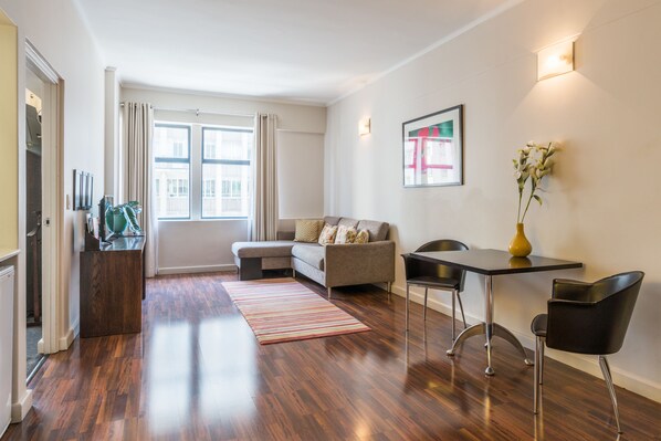 Luxury Apartment, 1 Bedroom | Living room | Flat-screen TV