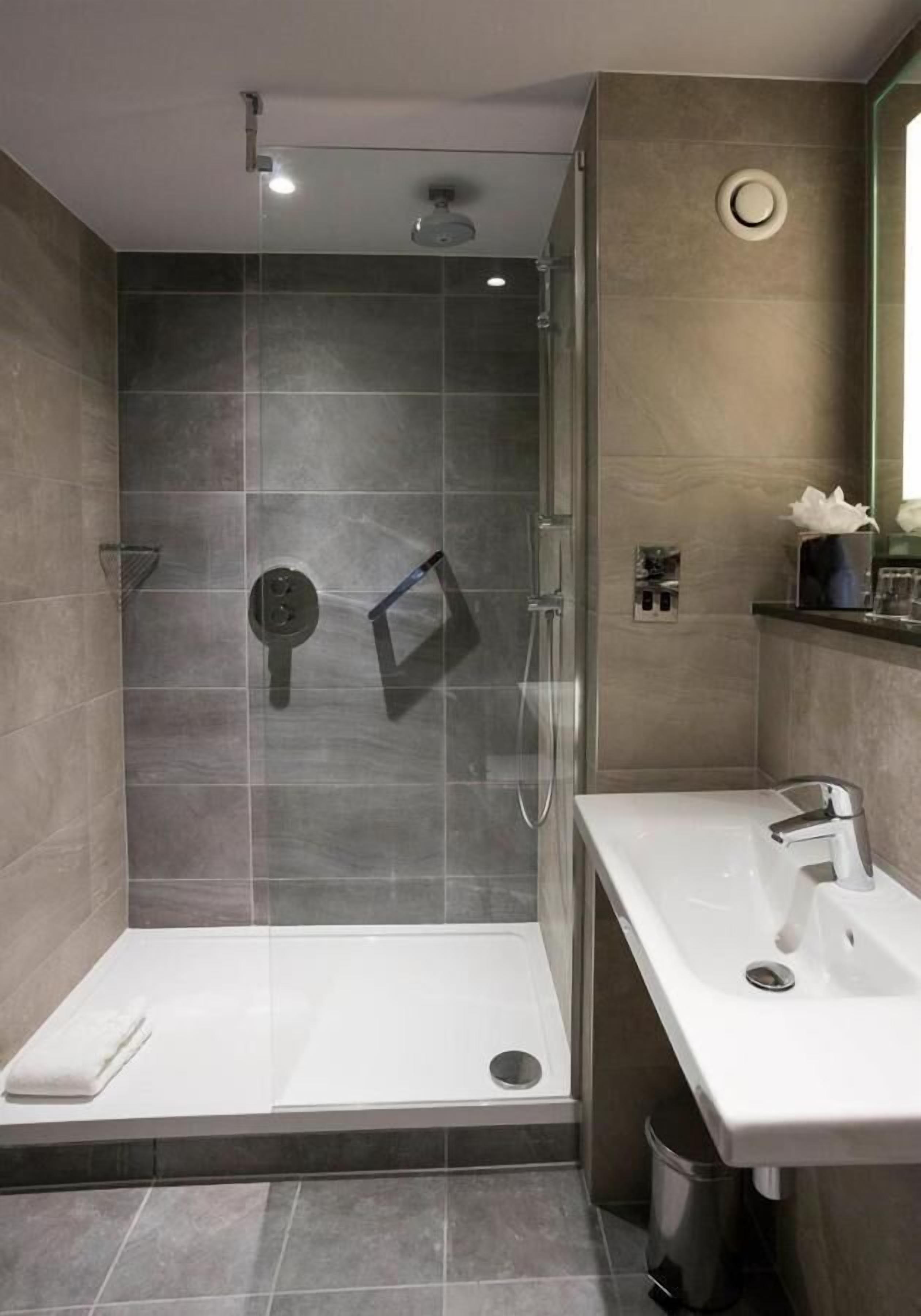 eco-friendly toiletries, hair dryer, slippers, towels