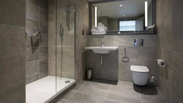 Eco-friendly toiletries, hair dryer, slippers, towels