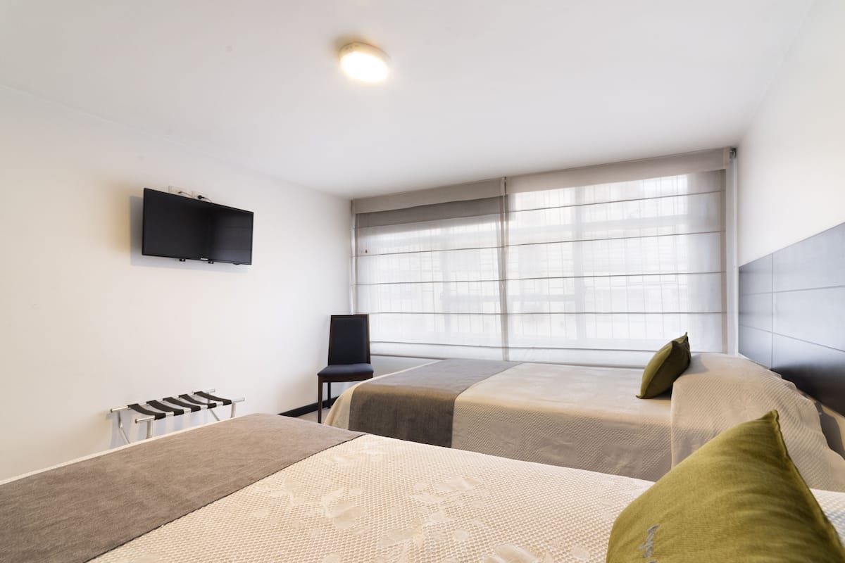 Desk, laptop workspace, free WiFi, bed sheets