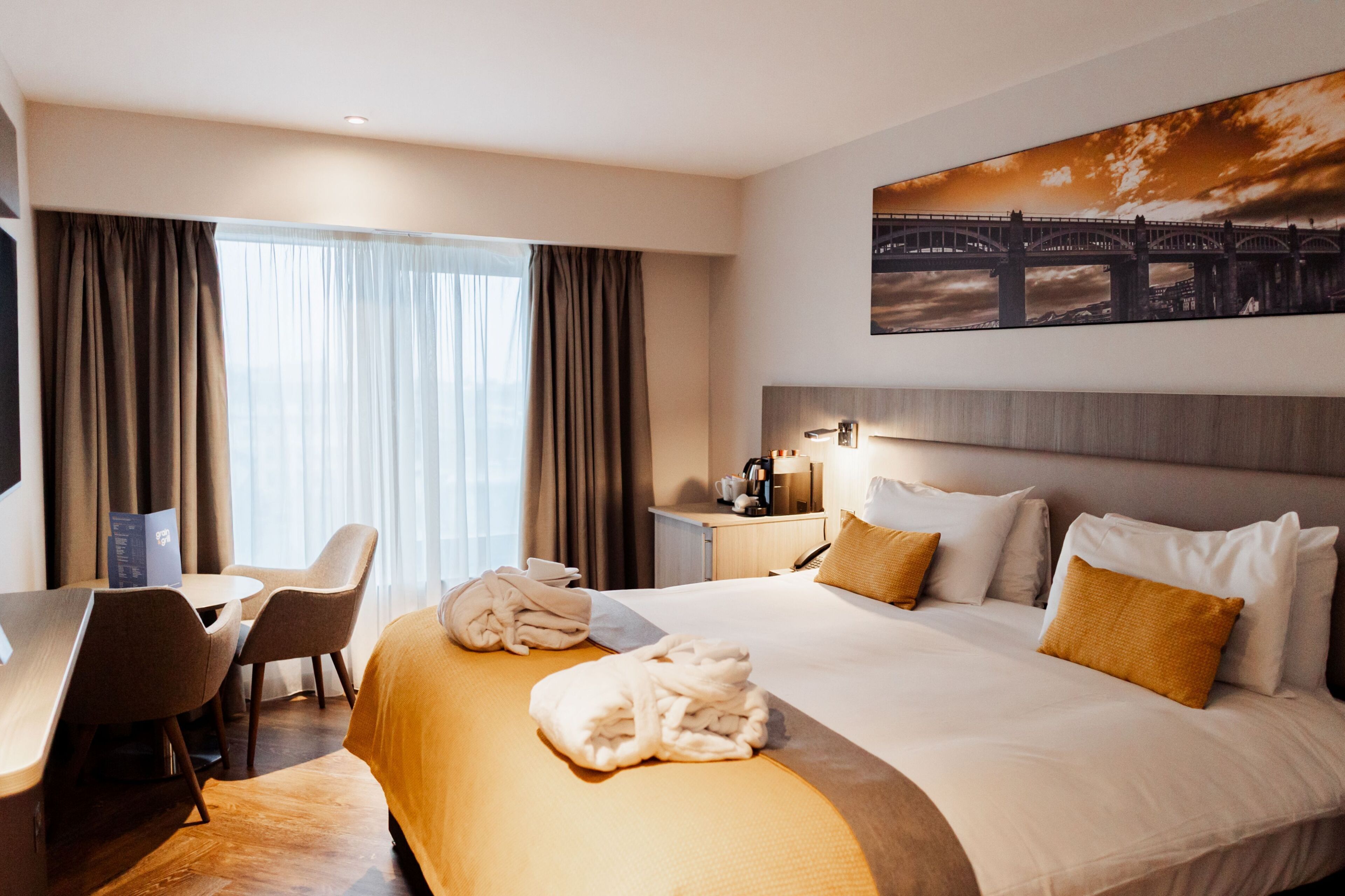 Hypo-allergenic bedding, in-room safe, laptop workspace