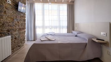 Geluiddichte muren, een strijkplank/strijkijzer, gratis wifi, beddengoed