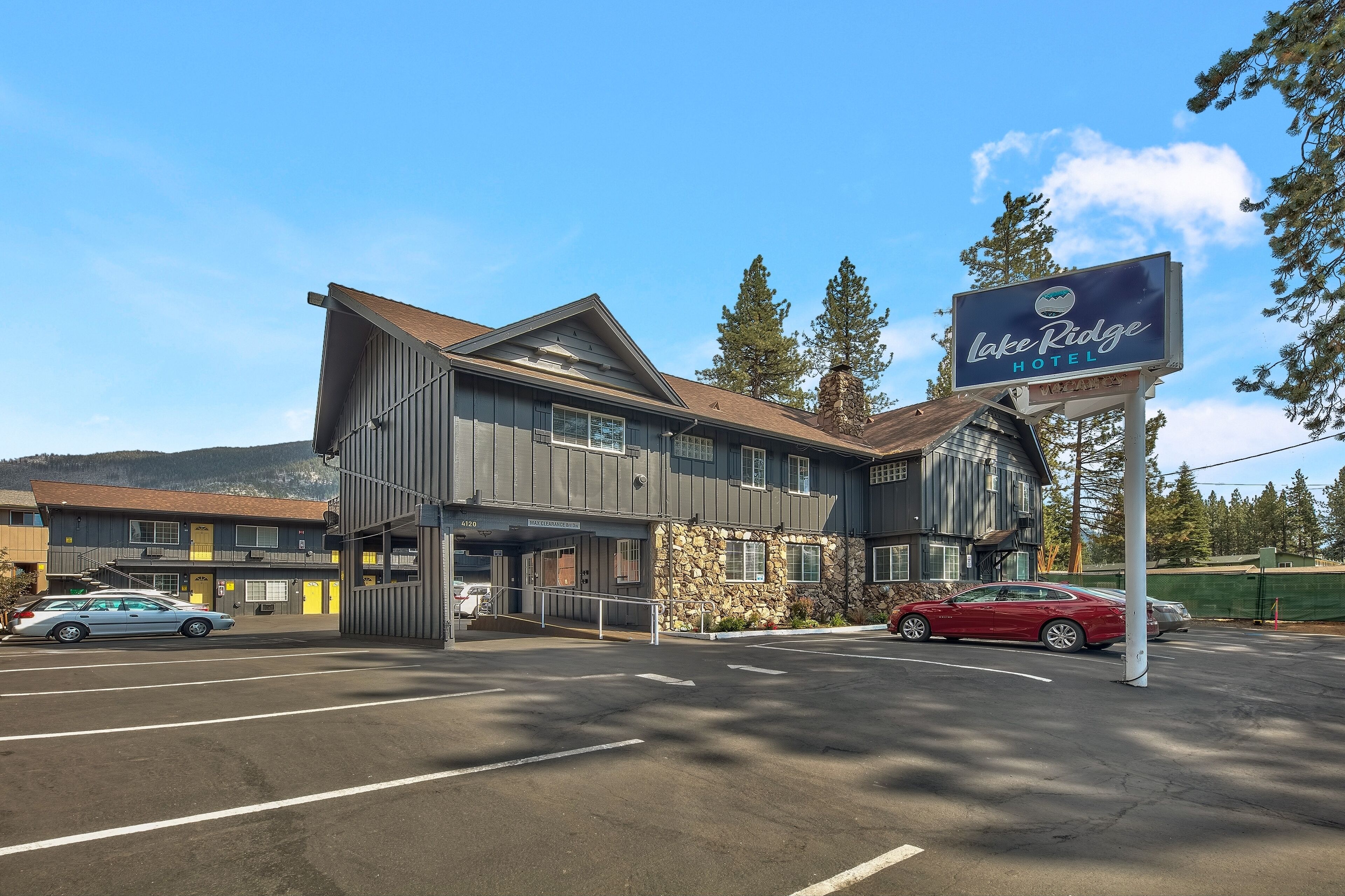A two-story building with a sign for Lake Ridge Hotel.